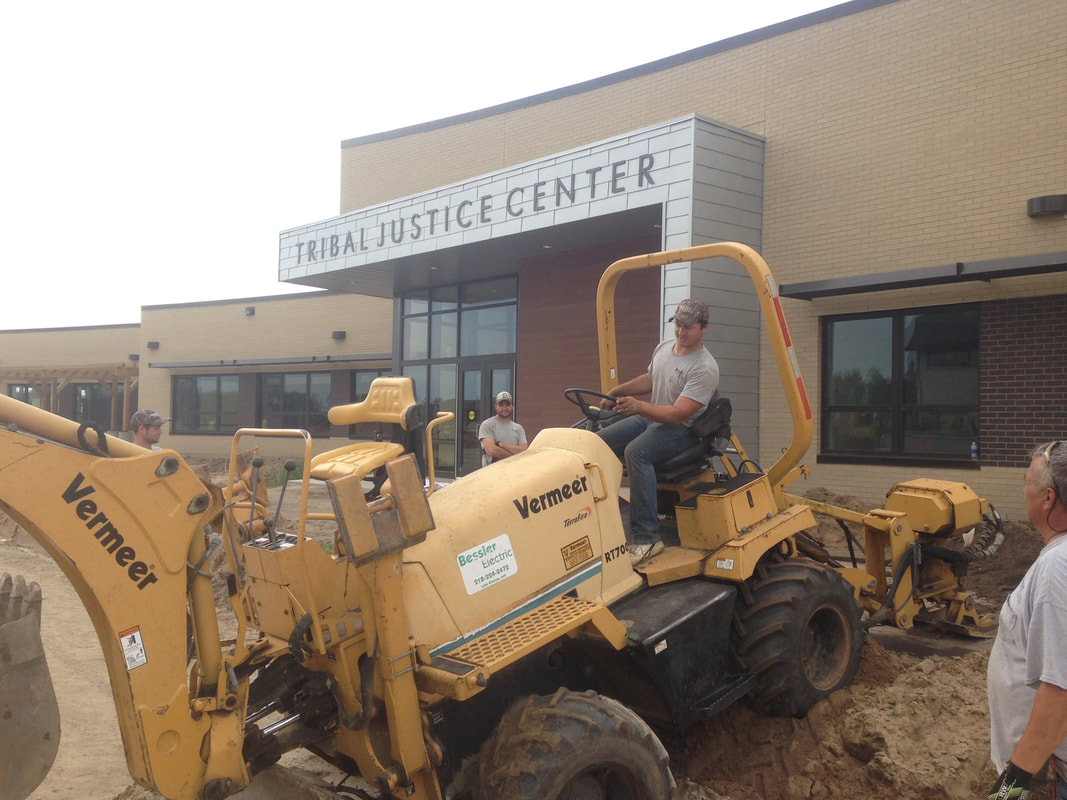 Bessler employees operating heavy machinery outside the Tribal Justice Center in Cass Lake, MN.